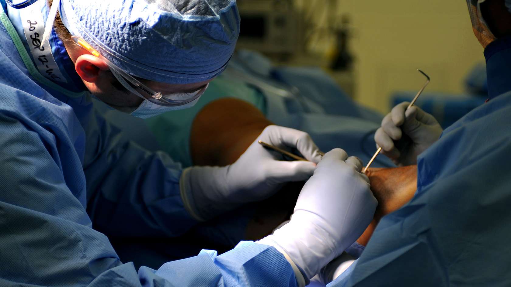 orthopedic surgeon and his team working on a patient